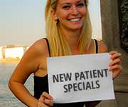 woman holding specials signs