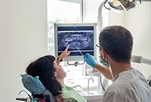 emergency dentist in West Palm Beach showing a patient their X-rays