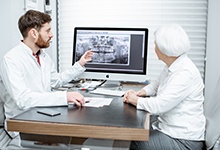 dentist showing a patient their dental X-rays