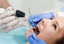 Woman getting teeth looked at