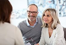 Couple consulting with dentist