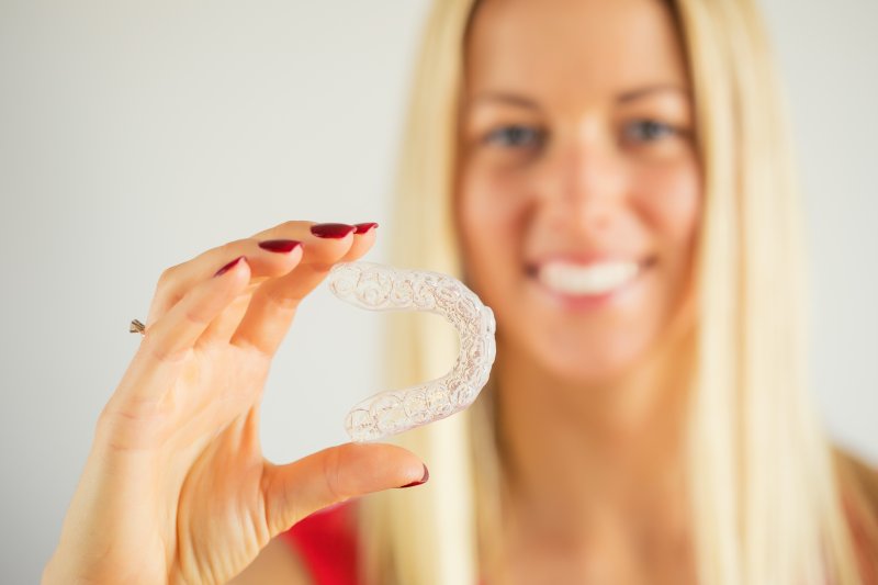 woman happy about having Invisalign in West Palm Beach (FL)