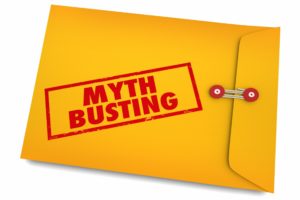 Yellow envelop busting dental implant myths. 